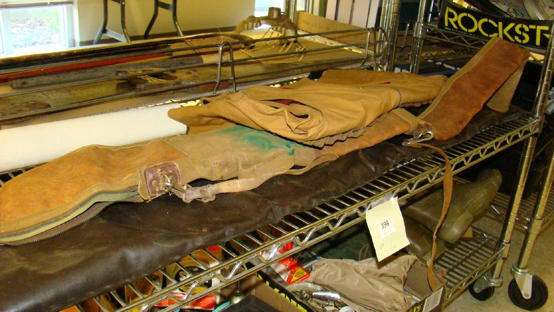 VINTAGE LEATHER GUN BAG-HUNTING VEST & MORE: VINTAGE LEATHER GUN BAG-HUNTING VEST- VINYL GUN BAG & MORE- LEATHER GUN BAG HAS STAINS & STRAP IS BROKEN-INSIDE FLEECE LINING IN VERY GOOD SHAPE-VINYL GUN BAG IS IN GOOD SHAPE WITH INNER FLEECE LINING