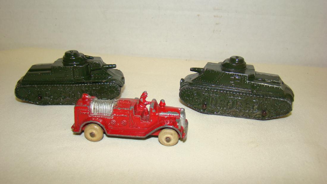 3 VINTAGE TOOTSIE TOY METAL TANKS AND FIRETRUCK: VINTAGE TOOTSIE TOY WHITE WHEEL FIRE TRUCK AND 2 TOOTSIE TOY METAL TANKS