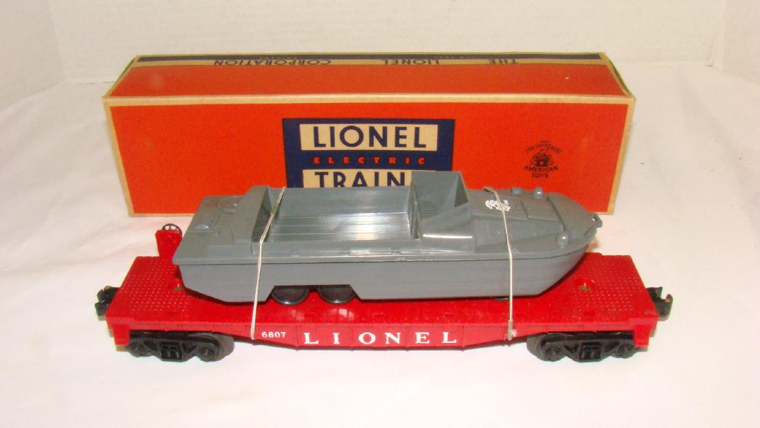 LIONEL FLAT CAR WITH USMC MILITARY BOAT 6807 - NIB: LIONEL FLAT CAR WITH USMC MILITARY BOAT 6807 - NIB - ONE FLAP ON THE BOX IS LOOSE