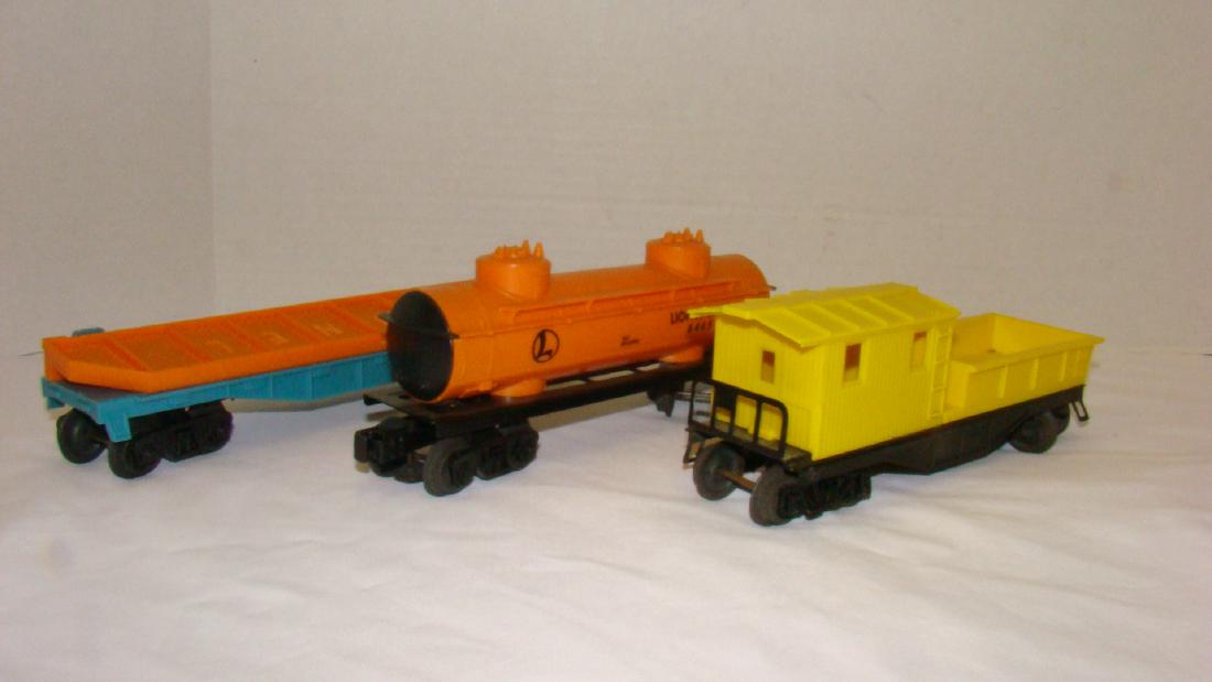 LIONEL 6465 TANKER AND 6511-2 FLAT CAR WITH GIRDER: LIONEL 6465 TANKER AND 6511-2 FLAT CAR WITH GIRDER AND YELLOW CABOOSE - NO BOXES