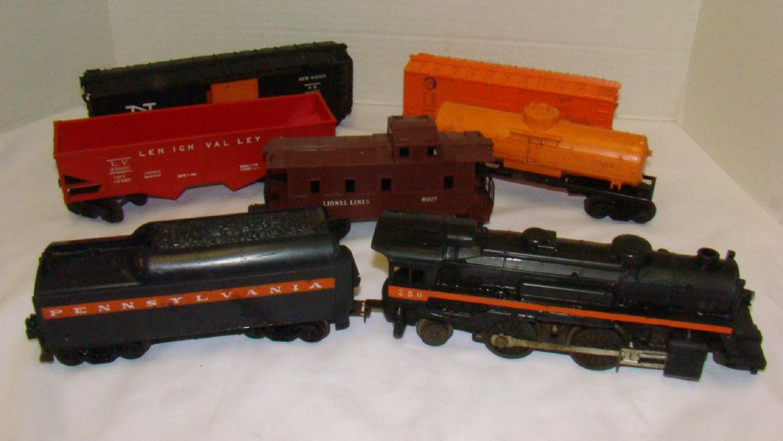 LIONEL LOCOMOTIVE 250 WITH TENDER & MORE: LIONEL LOCOMOTIVE 250 WITH TENDER & MORE - GULF TANKER CAR 6025 - BOXCAR X600- NEW HAVEN BOXCAR 6464425- RED HOPPER 25000 & 607 CABOOSE - ALL APPEAR COMPLETE - SOME TRUCKS WILL NEED REPLACING DUE TO A