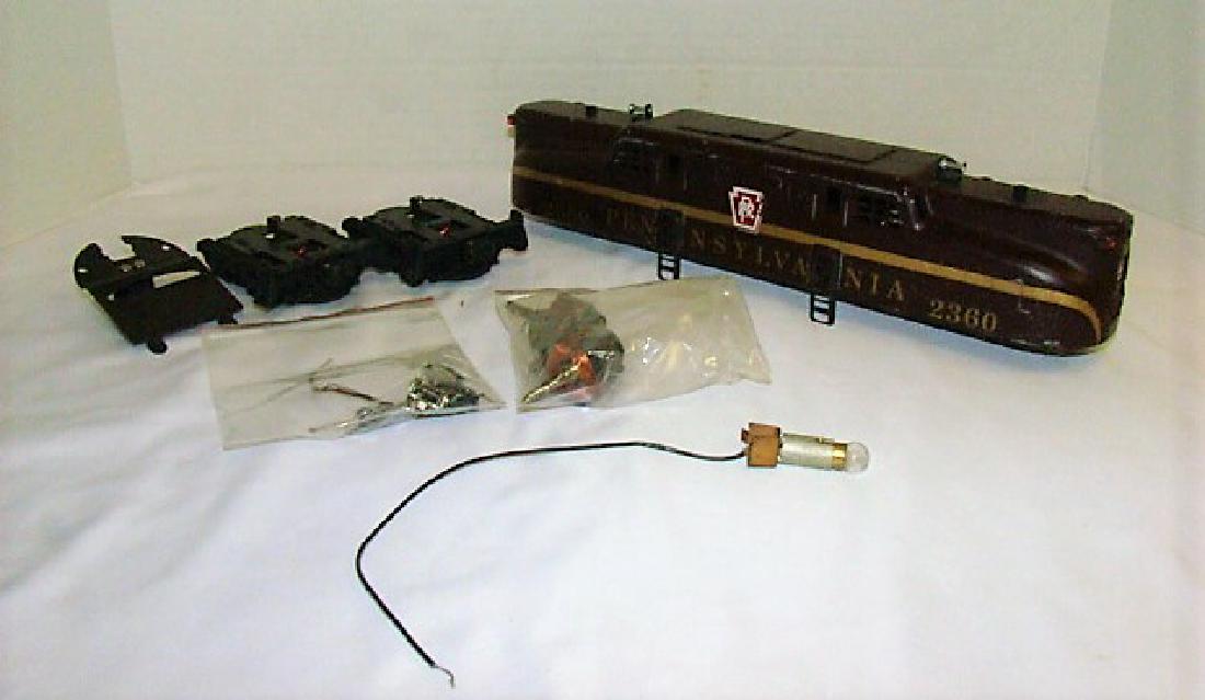 LIONEL CAB/SHELL 2360: LIONEL CAB/SHELL 2360 AND MISC PARTS- AS-IS FOR REPAIR/ PARTS.