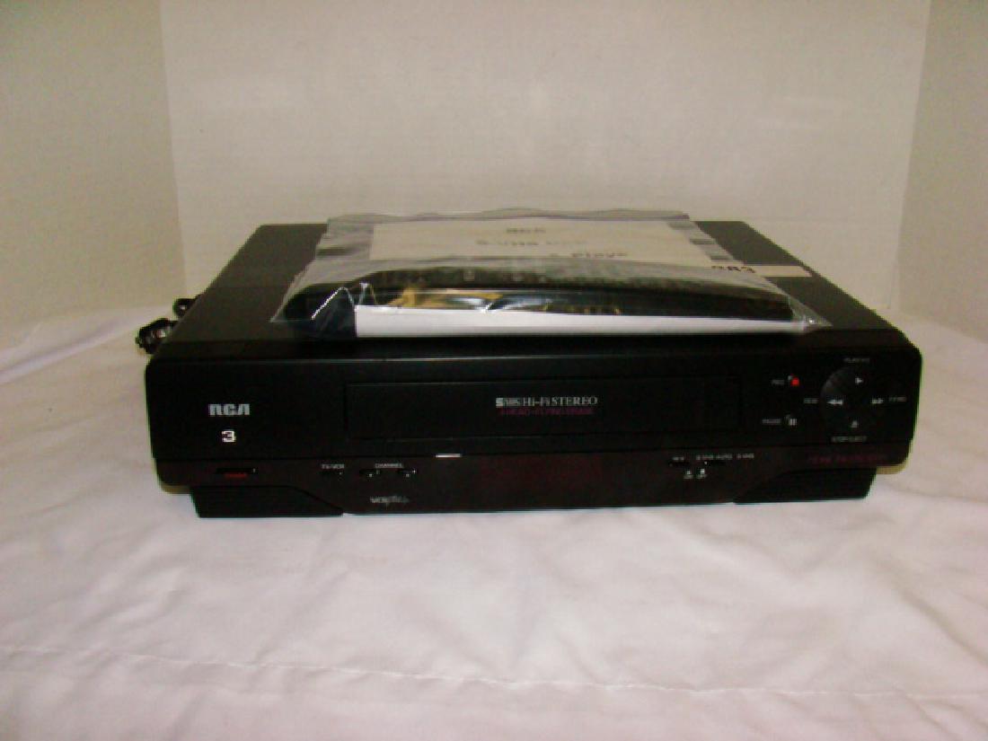 RCA VHS PLAYER WITH REMOTE (1 of 3)