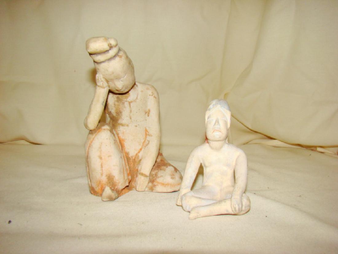 2 MMA ASIAN WOMAN FIGURES: 6'' CARVED CHALK TYPE FIGURE OF AN ASIAN WOMAN KNEELING DOWN HOLDING HER HAND - NO MARKS AND A 4'' POTTERY FIGURE OF AN ASIAN WOMAN SITTING CROW LEGGED - MARKED ON BOTTOM MMA