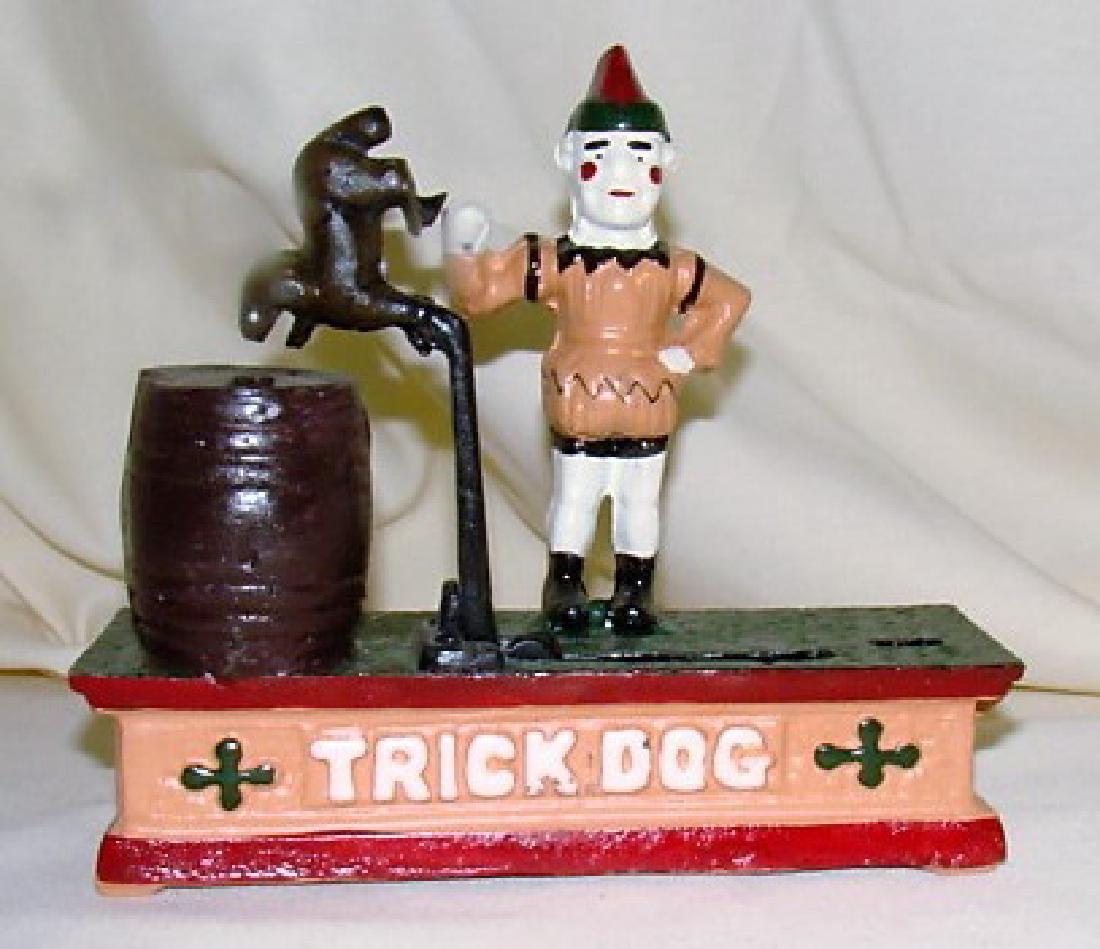 CAST IRON BANK: ANTIQUE CAST IRON TRICK DOG BANK- CLOWN IS MISSING HIS HOOP (FOR DOG TO JUMP THROUGH)- DOG DOESN’T LATCH DOWN- OTHER THAN THAT APPEARS TO BE IN GREAT CONDTITION- NO MAJOR PAINT LOSS- MADE IN CHINA R