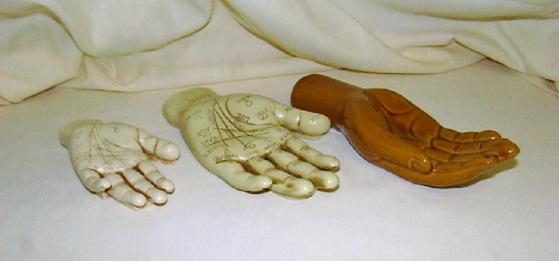3 HAND SCULPTURES: 3 HAND SCULPTURES- 1 CERAMIC HOLLOW- LIGHT BROWN/TAN COLOR- SMALL CRACKS THROUGHOUT THE PAINT- 2 WITH THE MARKINGS FOR PALM READING- 1 APPROX 7.75- 1 5.25 LABEL READS FROM THE GREENWOOD BY DAVID LAWRE