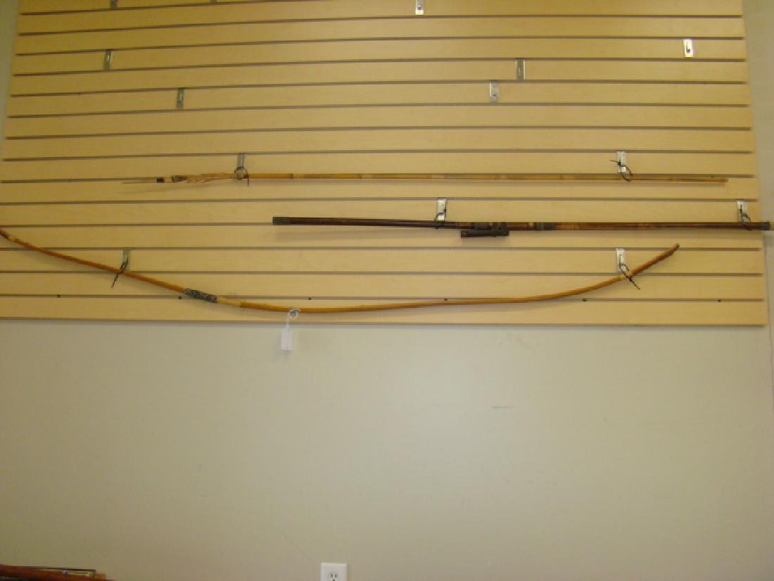 3 PRIMITIVE STYLE WEAPONS: 3 PRIMITIVE STYLE DECORATIVE WEAPONS - LONG BOW - NEEDS STRING - BLOW DART GUN AND A BAMBOO SPEAR
