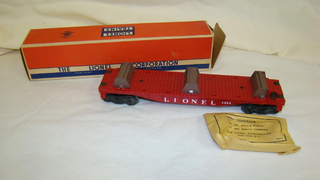 6264 LUMBER CAR BY LIONEL NIB: 6264 LUMBER CAR BY LIONEL NIB - INCLUDES FLAT CAR & CONTENTS PACKET WHICH CONTAINS 8 POSTS & 12 TIMBERS - BOX DAMAGE FLAP TORN OFF