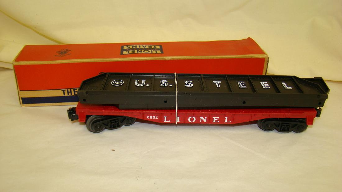 VINTAGE LIONEL FLAT CAR W/ GIRDERS NO. 6802: VINTAGE LIONEL NO. 6802 FLAT CAR WITH GIRDERS - LOOKS LIKE NEVER USED - ORIGINAL BOX - SHOWS AGE TORN ON ONE END WITH DAMAGED FLAP - SOME DISCOLORATION DUE TO AGE