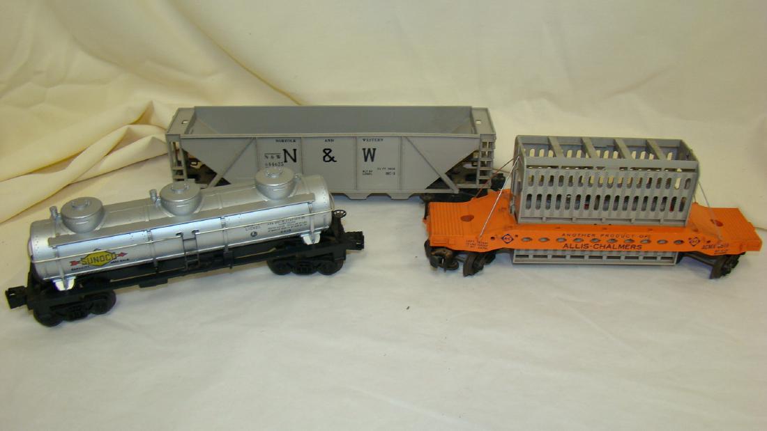 3 VINTAGE USED LIONEL TRAIN CARS: 3 USED VINTAGE LIONEL TRAIN CARS - NO BOXES - ACMX 6519 ALLIS CHALMERS CAR - GOOD CONDITION - NO. 6415 SUNCO TANKER CAR AND N&W 644625 GRAY CAR - MINOR DISCOLORATION - ALL WITHOUT BOXES