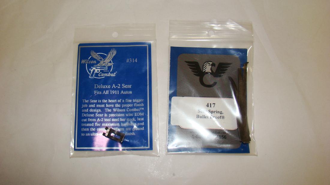 WILSON COMBAT SEAR SPRING 417 & DELUXE A-2 SEAR: WILSON COMBAT SEAR SPRING 417 & DELUXE A-2 SEAR - 417 SEAR SPRING - BULLET PROOF NIP & DELUXE A-2 SEAR FITS ALL 1911 AUTOS IN ORIGINAL PACKAGING- APPEARS UNUSED - AS IS