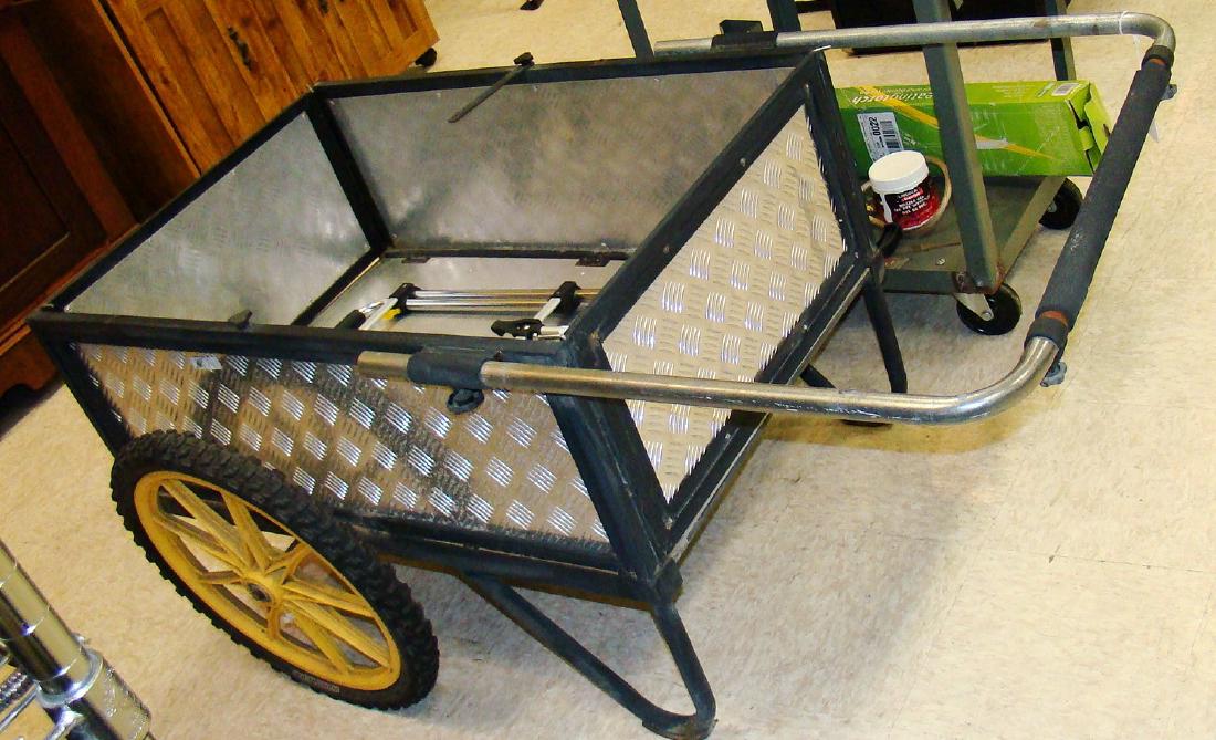 METAL ROLLING GARDEN CART: METAL ROLLING GARDEN CART - ADJUSTABLE HANDLE - CART STORAGE AREA APPROX. 36x 24 - GOOD CONDITION - DECORATIVE METAL SIDES AND SMALL ROLLING CART