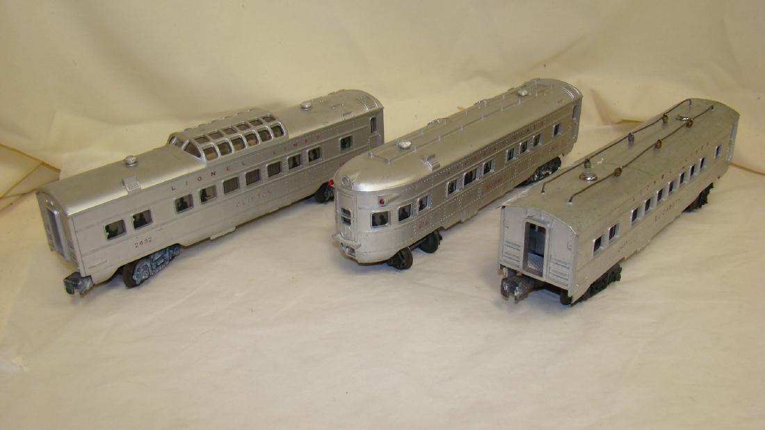 3 USED LIONEL NO. 2432, 2435 AND 2436 TRAIN CARS: USED LIONEL NO. 2432 CLIFTON DOME VISTA PASSENGER CAR - MINOR SCRATCHES - WHEELS HAVE RESIDUE - NO TESTED - NO. 2435 ELIZABETH PASSENGER CAR - WINDOWS MISSING THE PASSENGER STRIP - JUST OPEN HOLES - -