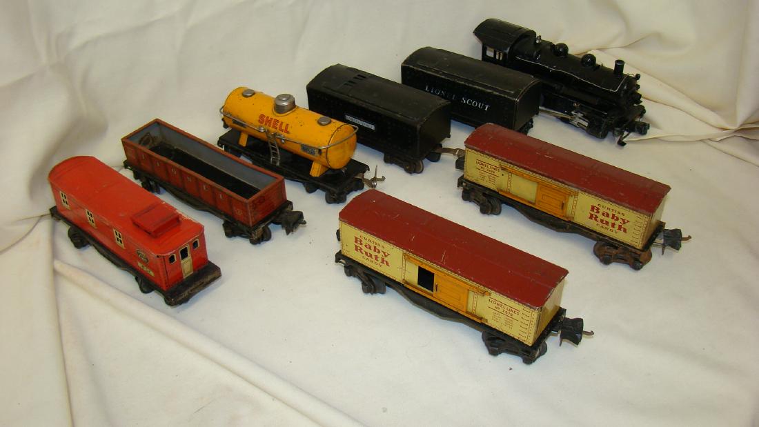 LIONEL LOCOMOTIVE 1665 & 5 TIN TRAIN CARS: LIONEL LOCOMOTIVE 1665 & 5 TIN TRAIN CARS -LOCOMOTIVE 1665 & 2 TENDERS - SHELL TANKER 654 - GONDOLA 2677 - 2 BABY RUTH BOXCARS 2679 & CABOOSE 1682 - NORMAL AGE WEAR & CONDITIONS - LOCOMOTIVE UNTESTED