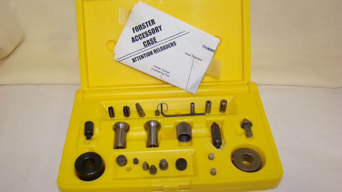 FORSTER ACCESSORY CASE- INCOMPLETE: FORSTER ACCESSORY CASE- INCOMPLETE- YELLOW FORSTER CASE FOR STORING FORSTER TRIMMER ACCESSORIES- INCOMPLETE- APPEARS TO BE MISSING 2 OUTSIDE NECK TURNING PILOTS, CASE TRIMING PILOTS, & SOME NECK REAME