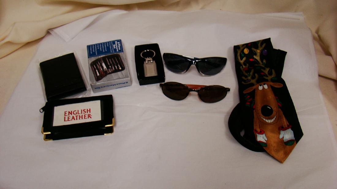 LOT OF MEN'S ACCESSORIES: LOT OF MEN'S ACCESSORIES- 2 PAIRS OF SUNGLASSES- SILVER TONED KEYCHAIN NIB- FAUX LEATHER POCKET NOTEPAD- BLACK- SUEDE LEATHER POCKET/WALLET SIZED PHOTO BOOK- & MORE