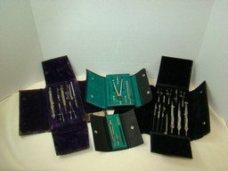 VINTAGE DRAFTING TOOLS-MULTIPLE SETS: VINTAGE DRAFTING TOOLS-MULTIPLE SETS- AMCO WEST GERMANY 1369 MISSING ONE PIECE-TWO GERMAN SETS INCOMPLETE BUT MANY INSTRUMENTS INCLUDED AND A SCHOENNER DRAFTING TOOL SET-VARIOUS CONDITIONS