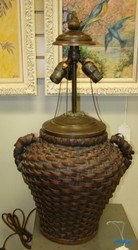 CRAFTMAN'S STYLE LAMP: CRAFTMAN'S STYLE LAMP - 2 HANDLED BASKET DESIGN - NO SHADE - HOLDS 3 BULBS EACH WITH THEIR OWN PULL CHAINS - METAL FINIAL TOP - UNTESTED - ONE HANDLE APPEARS TO BE UNRAVELING