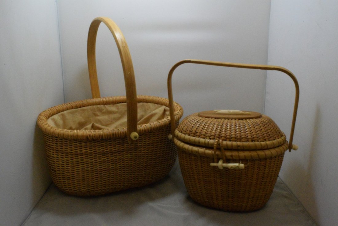2 HAND WOVEN BASKETS WITH CARVED BONE LIKE TRIM: 2 HAND WOVEN BASKETS WITH CARVED BONE LIKE TRIM - LID HAS A CARVED WHALE ON TOP - NEEDS RE-ATTACHMENT