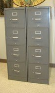 TWO GREY METAL FOUR DRAWER METAL FILING CABINETS: TWO GREY METAL FOUR DRAWER FILING CABINETS - FAIR CONDITION - DRAWERS WORKING - ONE TOP DRAWER HAS ATTACHED SLIDING DIVIDERS