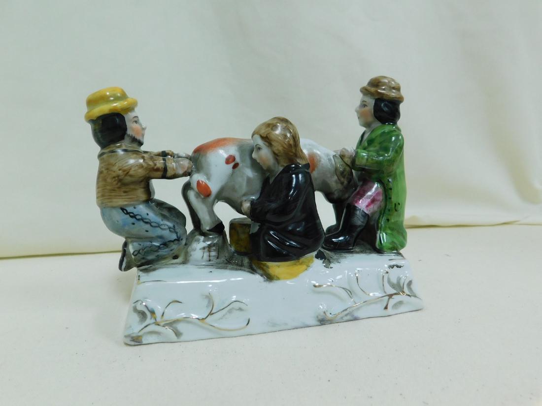 VINTAGE 3 MEN MILKING A COW PORCELAIN FIGURINE (1 of 2)