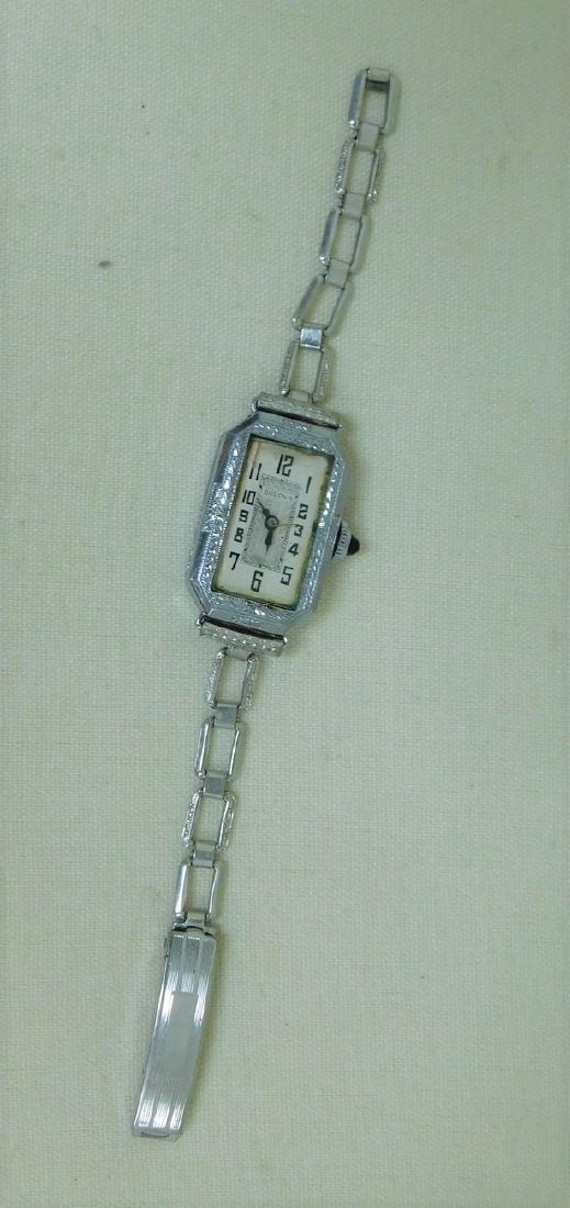 ANTIQUE LADIES BULOVA WATCH: ANTIQUE LADIES BULOVA WRISTWATCH - NOT WORKING - SMALL WRIST STAMPED DESIGN AROUND FACE AND ON BACK - SILVER COLOR