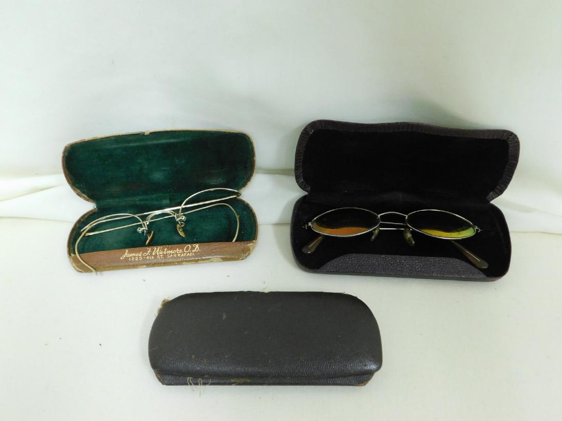 ANTIQUE GLASSES & CASES: ANTIQUE GLASSES & CASES - PAIR OF SUNGLASSES IN CASE - MARKED MADE IN ENGLAND - FRAMES IN CASE - CASE IS TAPED TOGETHER - 1 SINGLE CASE - SHOW AGE AND WEAR.