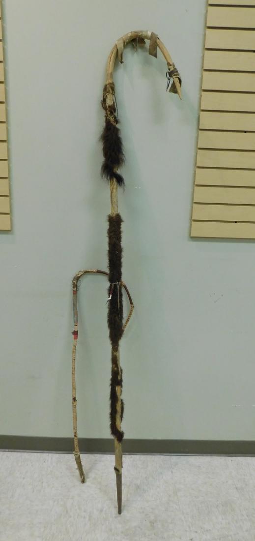 2 NATIVE AMERICAN MOVIE PROP STAFFS: 2 NATIVE AMERICAN MOVIE PROP STAFFS - 8 FOOT CARVED WOOD WITH BUFFALO FUR OVERLAY & LEATHER STRAPS & 3.5 FOOT WRAPPED BENT WOOD - BOTH SHOW WEAR - USED IN WESTERN MOVIES 1930-1950S - FROM ELLIS PROPS