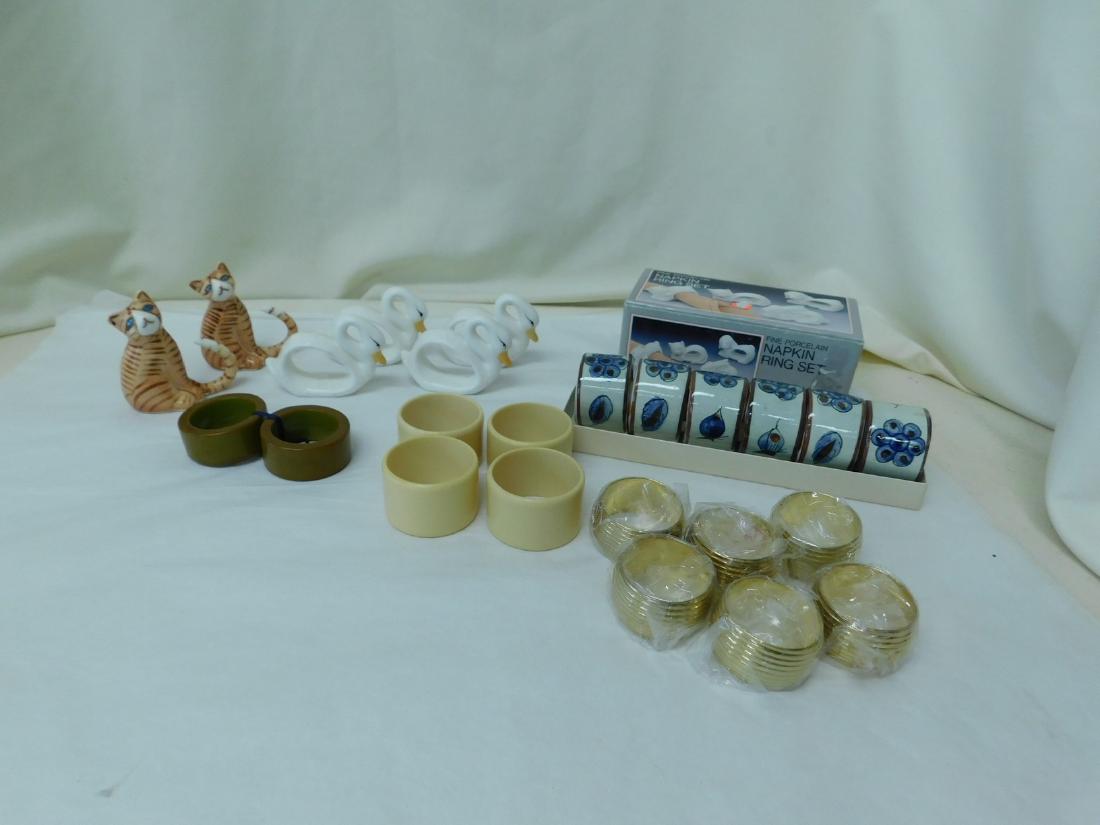 BAKELITE - CELLULOID - CLAY NAPKIN RINGS & MORE: BAKELITE - CELLULOID -CLAY NAPKIN RINGS & MORE - PAIR OF THICK OLIVE GREEN BAKELITE NAPKIN RINGS - SET OF 4 IVORY COLORED CELLULOID NAPKIN RINGS - SET OF SIX CLAY NAPKIN RINGS - FINE PORCELAIN NAPKIN