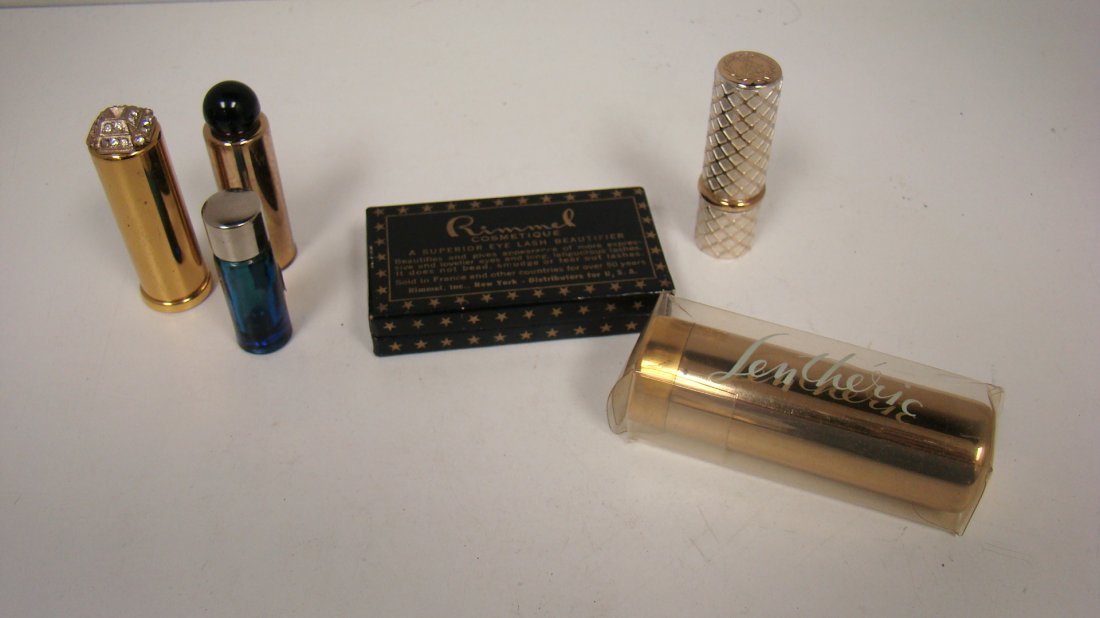 LOT OF VINTAGE COSMETICS: LOT OF VINTAGE COSMETICS - (4) MINITURE PERFUME BOTTLES; 1 GOLD WITH RHINSTONED TOP, 1 GOLD WITH BLACK SCREW TOP, 1 BLUE GLASS WITH SILVER TOP ''EVENING IN PARIS'', 1 TWEED LENTHERIC ''PURSE ICICLE''