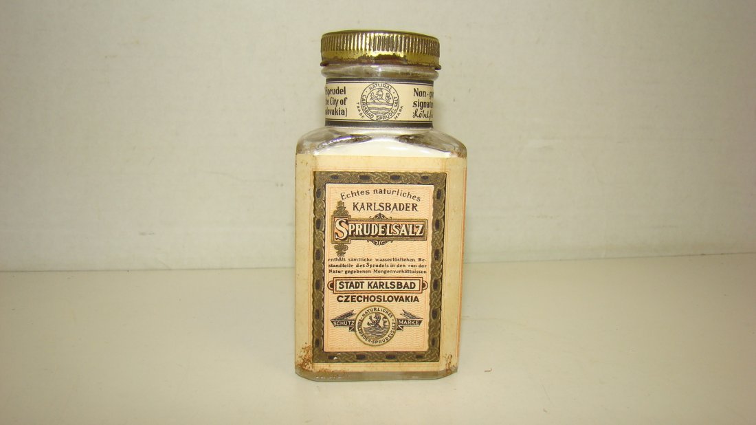 VINTAGE 4.5'' BOTTLE OF SPRUDELSALZ: VINTAGE 4.5'' GLASS BOTTLE NATURAL CARLSBAD SPRUDEL SALT -PINK BLACK AND WHITE LABEL - EMBOSSED ON BACK OF BOTTLE ''CARLSBAD CZECHOSLOVAKIA - LABEL READS ECHTES NATURLICHES KARLSBADER SPRUDELSALZ