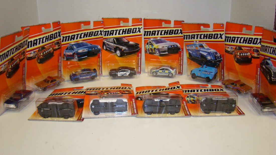 12 MATCHBOX EMERGENCY RESPONSE CARS-2009/10: 12 VARIOUS 2009 & 2010 MATCHBOX EMERGENCY RESPONSE SERIES CARS - NIP - (4) NO. 53 1978 DODGE MONACO POLICE CARS - DIFFERENT COLORS - (3) NO. 57 MITSUBISHI LANCER EVOLUTION X CARS - (3) NO. 58 DODGE CH