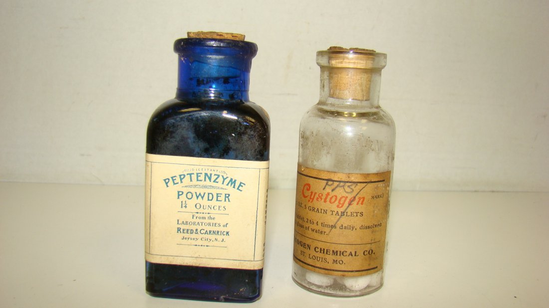 VTG 1.25 OZ PEPTENZYME POWDER MEDICINE BOTTLE-MORE: VINTAGE 1.25 OUNCE PEPTENZYME POWDER BLUE COBALT GLASS MEDICINE BOTTLE - ORIGINAL LABEL - CORK STOPPER AND A 1 OUNCE CLEAR GLASS CYSTOGEN MEDICINE BOTTLE - CORK STOPPER