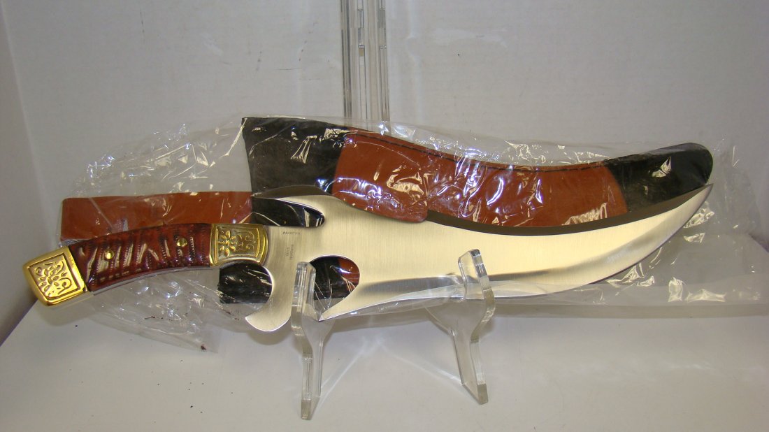 NIB CHIPAWAY CUTLERY ''THE CRUSADER'' KNIFE: NIB - CHIPAWAY CUTLERY - THE CRUSADER FANTASY KNIFE - 16'' OVERALL CUSTOM BOWIE - UNIQUE DESIGN CHESTNUT SAW CUT HANDLE - EMBOSSED BRASS BOLSTERS - GENUINE LEATHER SHEATH - SHEATH HAS MINOR RUST AT BR