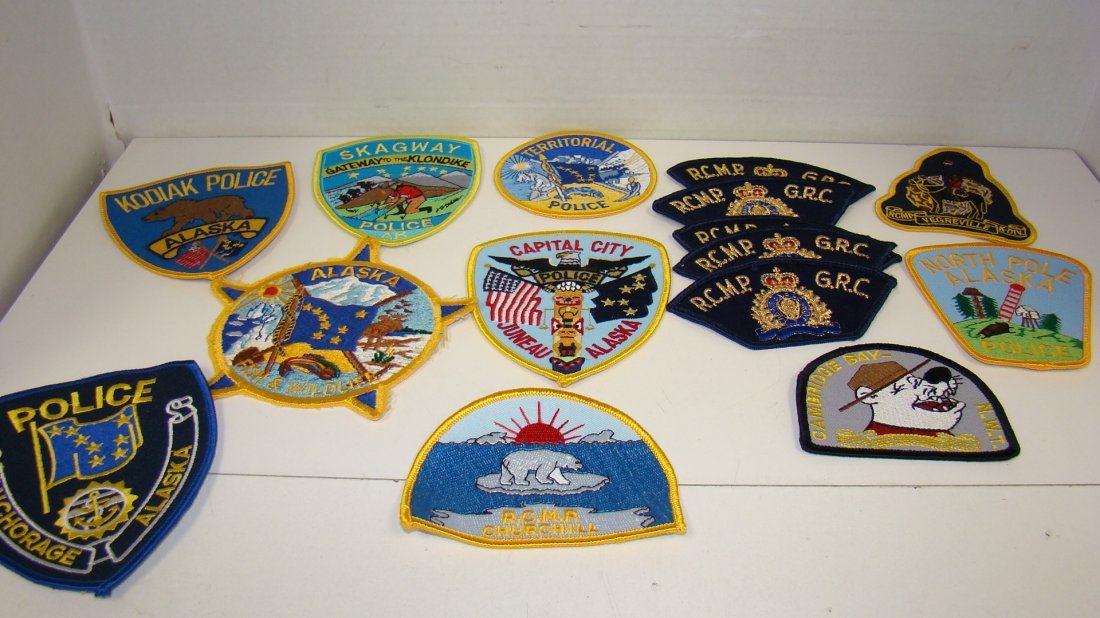 15 ALASKA & CANADA LAW ENFORCMENT PATCHES: 15 VARIOUS LAW ENFORCEMENT PATCHES FROM ALASKA - CANADA - KODIAK ALASKA POLICE - ANCHORAGE ALASKA POLICE - R.C.M.P. CHURCHILL - JUNEAU ALASKA CAPITAL CITY POLICE - ALASKA FISH AND WILDLIFE - SKAGWAY A