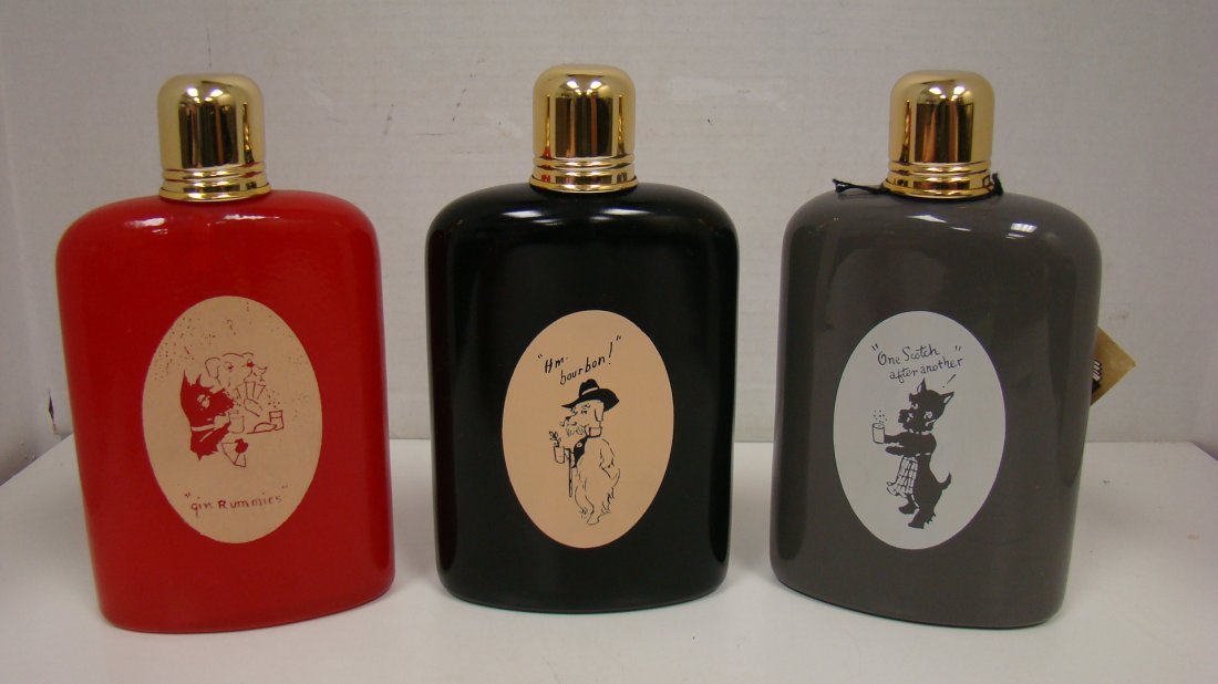 SET OF 3 VINYL COVERED FLASKS-DOG MOTIF: SET OF 3 VINYL COVERED FLASKS - FRENCH DOG MOTIF - GIN RUMMIES - ONE SCOTCH AFTER ANOTHER AND HM BOURBON. LABEL READS DELUXE BAR BY DYNAMIC. NO CASE.