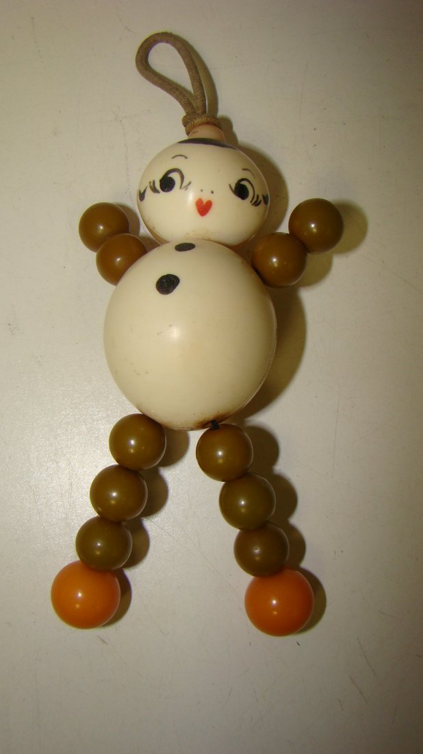 VTG CELLULOID AND BAKELITE CRIB TOY: VINTAGE HAND PAINTED CELLULOID AND BAKELITE CRIB TOY - 6'' - GOOD CONDITION
