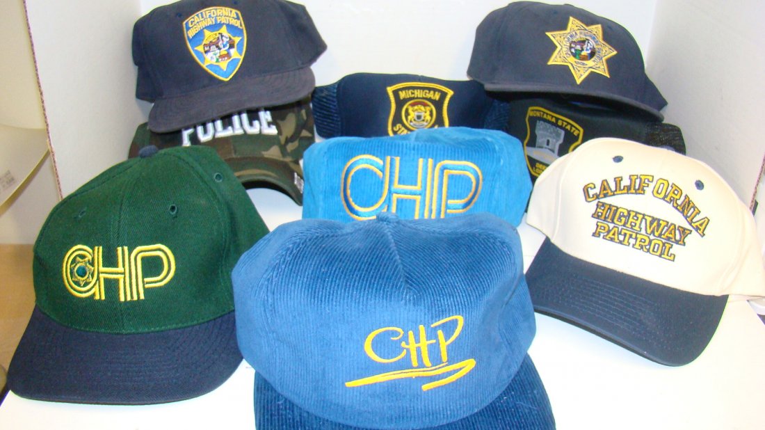9 VARIOUS LAW ENFORCEMENT BALL CAPS: 9 VARIOUS ''NEW'' LAW ENFORCEMENT BALL CAPS - CAMO COLOR POLICE CAP - MICHIGAN STATE POLICE - MONTANA STATE PRISON DEER LODGE - BLUE CHP - BEIGE AND GREEN CALIFORNIA HIGHWAY PATROL - GREEN CHP - NAVY