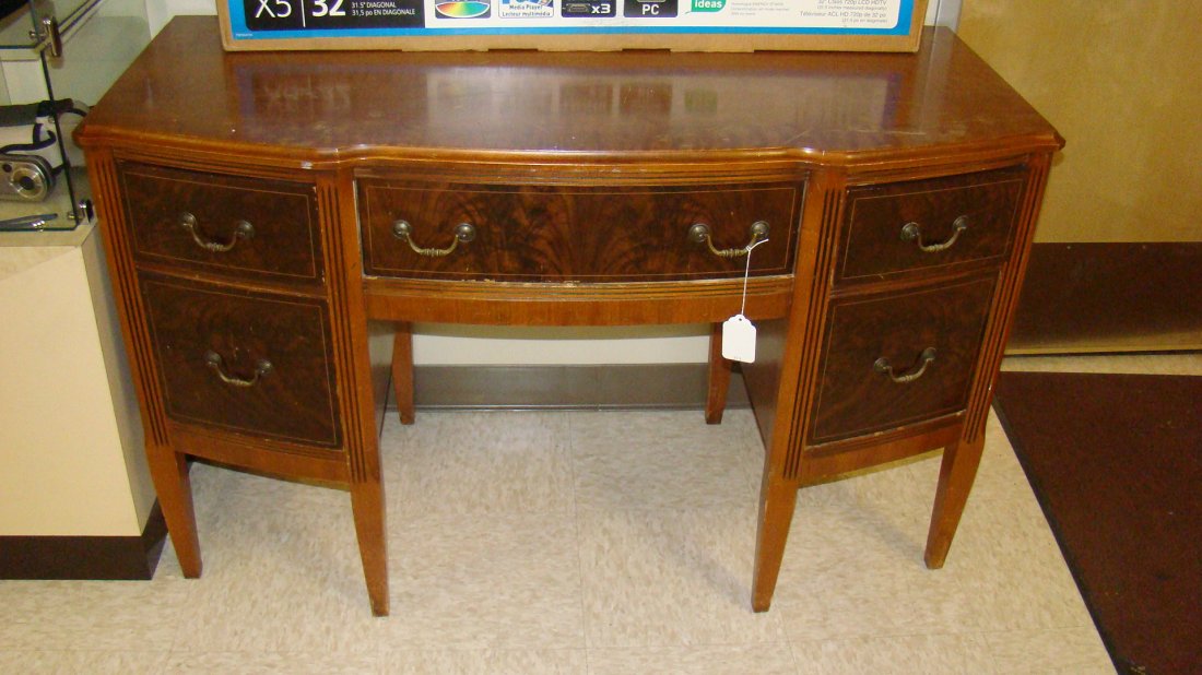 VINTAGE VENEER 5 DRAWER DESK: VINTAGE VENEER AND BURL 5 DRAWER DESK - FRONTS OF DRAWERS HAVE THE LOOK OF BURL WOOD - BRASS HANDLES - SCRATCHES ON TOP - COULD USE SOME TLC - APPROX 31''x 48''x 18'' - BUYERS RESPONSIBLE FOR MAKING S