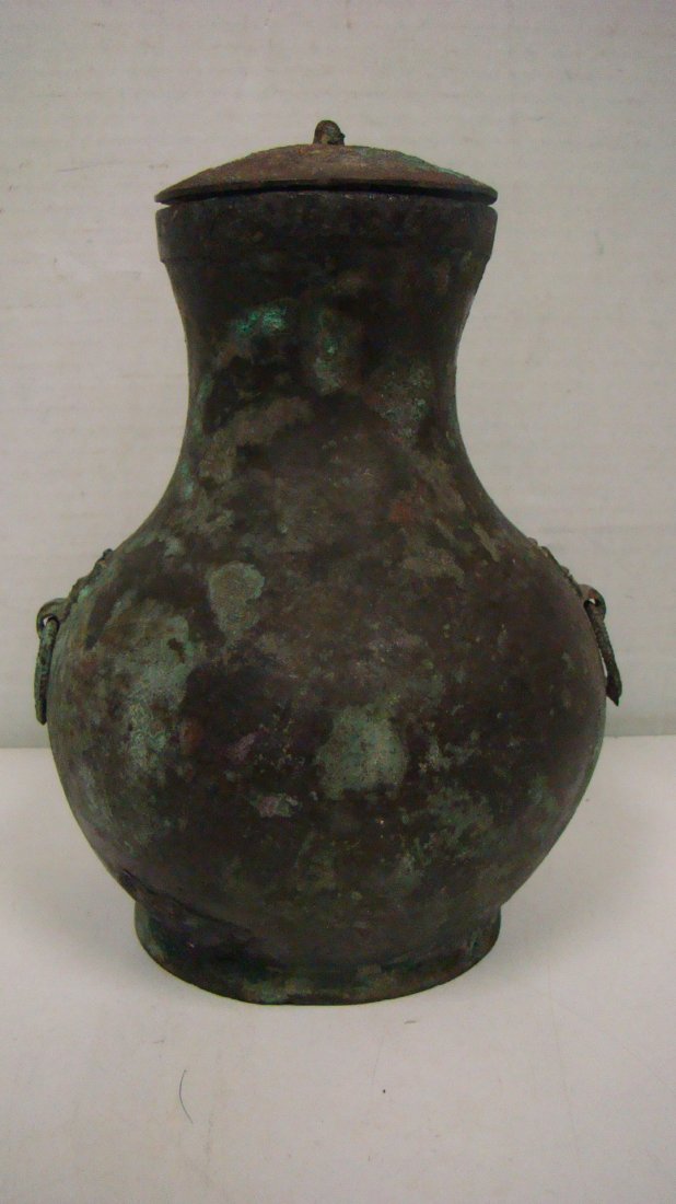 ANTIQUE ASIAN METAL URN: ANTIQUE ASIAN METAL URN - GREAT PATINA - 2 SMALL RING SHAPED SIDE HANDLES - SPADE SHAPED SYMBOLS ON LID -7'' - MID 1800'S