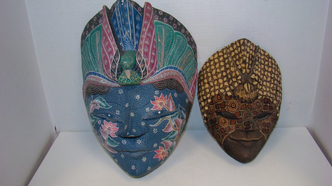 2 INDONESIAN WOOD MASKS: 13'' INDONESIAN BLUE BATIK MASK - CHIP ON NOSE AND A 9'' INDONESIAN BROWN BATIK FACE MASK - GOOD CONDITION
