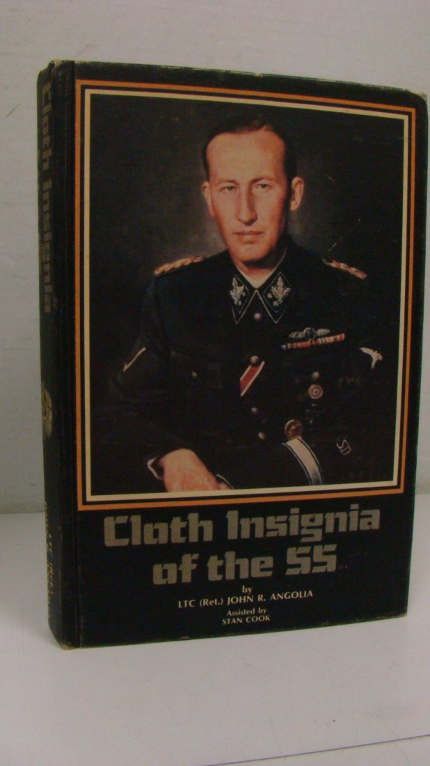 1983 FIRST EDITION ''CLOTH INSIGNIA OF THE SS'': 1983 FIRST EDITION ''CLOTH INSIGNIA OF THE SS'' - BY LTC (RET) JOHN R. ANGOLIA - ASSISTED BY STAN COOK - NO DUST COVER - MINOR WEAR SHOWS ON OUTSIDE CORNERS - INSIDE IS IN GOOD CONDITION - THIS BOOK C
