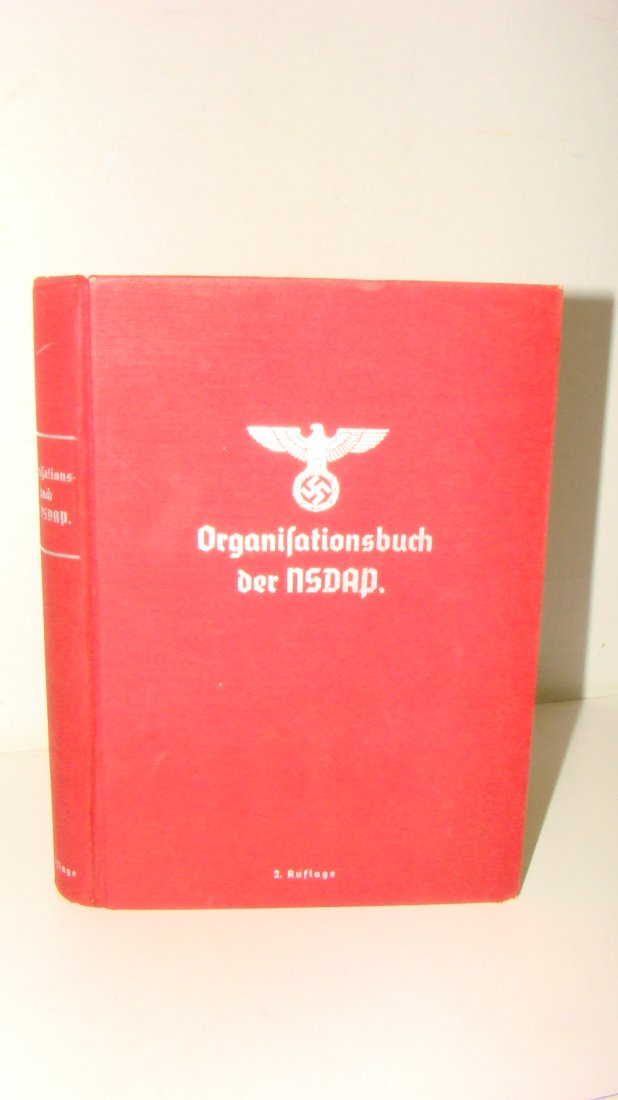 1937 EDITION ORGANIFATIONSBUCH der NSDAP: 1937 EDITION OF THE GERMAN BOOK ''ORGANIFATIONSBUCK der NSDAP'' NAZI STAMP ON INSIDE COVER - DR. ROBERT LEY - INSIDE BINDING IS STARTING TO COME LOOSE - NO DUST COVER - SOME MINOR WEAR ON COVER AND SM