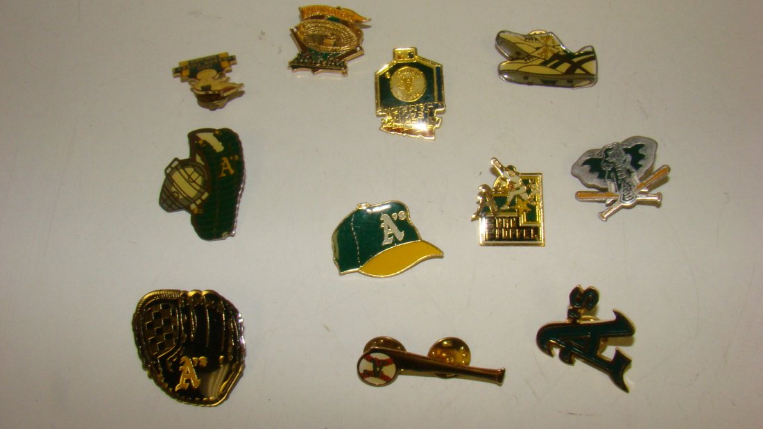 11 VARIOUS OAKLAND A'S LAPEL PINS: 11 VARIOUS OAKLAND A'S BASEBALL LAPEL PINS - SNEAKERS - MITT - CATCHERS VEST - OAKLAND COLISEUM - ELEPHANT WITH 2 BATS - HAT - 1990 SEASON TICKET HOLDER - TODD VAN POPPEL - 1990 AMERICAN LEAGUE CHAMPI