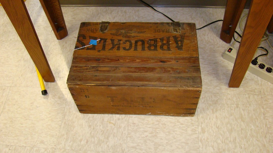 ANTIQUE HOME MADE WOOD COVERED BOX: ANTIQUE HOME MADE WOOD COVERED STORAGE BOX - USING WOOD FROM SHIPPING BOXES - TOP READS ARBUCKLES - SIDE READS TALL'S 4 OZ CANS - LEATHER STRAPS TO HOLD TOP ON - FUN ITEM - 10''x 20''x 13.5'' - BUYER 