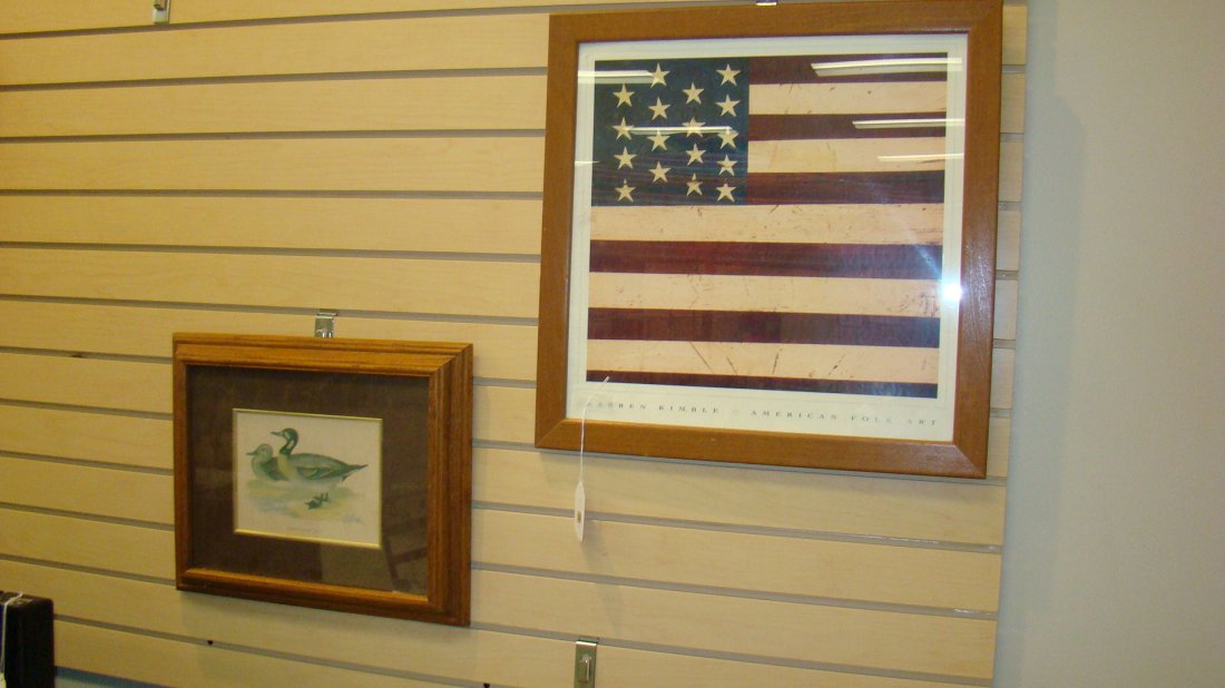 2 FRAMED PRINTS: FRAMED DUCK PRINT ''BIMACULATED DUCK - 14''x 17'' OAK FRAME AND A FOLK ART STYLE FRAME PRINT OF THE AMERICAN FLAG - WARREN KIMBLE - APPROX 21''x 20'' IN FRAME - GOOD CONDITION - BUYER RESPONSIBLE FOR 