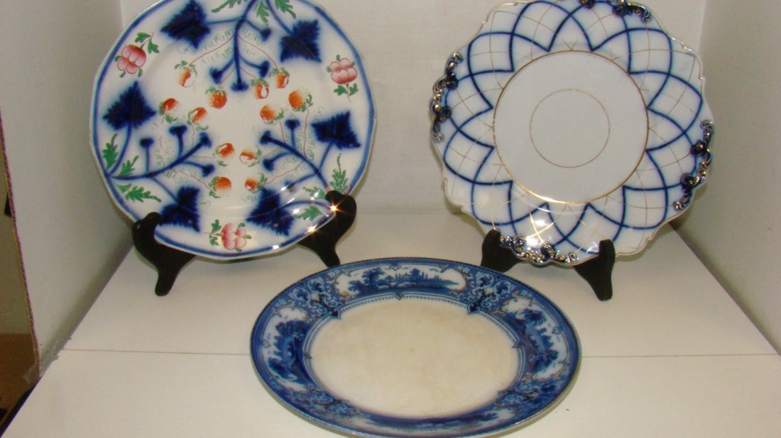 3 VINTAGE FLOW BLUE PLATES: 9.5'' F & SON'S FLOW BLUE PLATE - VERONA PATTERN - CENTER HAS CRAZING AND SLIGHTLY DISCOLOREDITION - 10'' OPAQUE CHINA FLOW BLUE PLATE - GOLD ACCENTS - MINOR PAINT LOSS AND A 9.5'' FLOW BLUE PLATE WIT