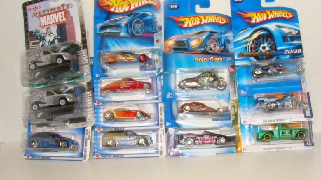 11 NIB HOT WHEELS & 2 NIB MAISTO CARS: 2 NIB MAISTO ULTIMATE MARVEL DIE-CAST CARS - SILVER SURFERS AND 11 VARIOUS NIB HOT WHEELS - VARIOUS SERIES AND YEARS - (4) 2003 FIRST EDITIONITIONS - 2 NO. 035 BOOM BOX - NO. 029 GOLDEN ARROW AND NO. 