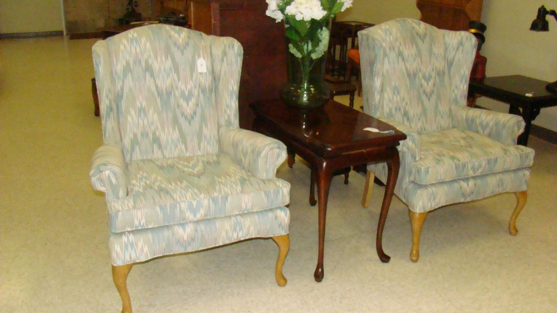 UPHOLSTERED WINGBACK CHAIR: UPHOLSTERED WINGBACK CHAIR GEOMETRIC PASTEL PATTERN FABRIC - CARVED WOOD LEGS - LIKE NEW CONDITION - APPROX 51''x 32''x 32'' - THESE CHAIRS ARE VERY WELL MADE AND IN BEAUTIFUL CONDITION - BUYER RESPON