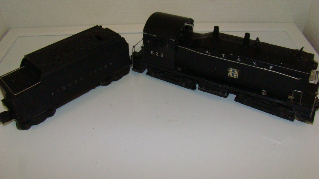 VINTAGE LIONEL NO. 623 LOCOMOTIVE & TENDER-NO BOX: VINTAGE LIONEL NO. 623 LOCOMOTIVE AND TENDER - O GAUGE - TENDER WHISTLES - APPEARS TO BE IN GOOD CONDITION BUT UNTESTED - NO BOX - A.T.& S.F. - DIRTY - FROM THE COLLECTION OF A 97 YEAR OLD LIONEL REPA